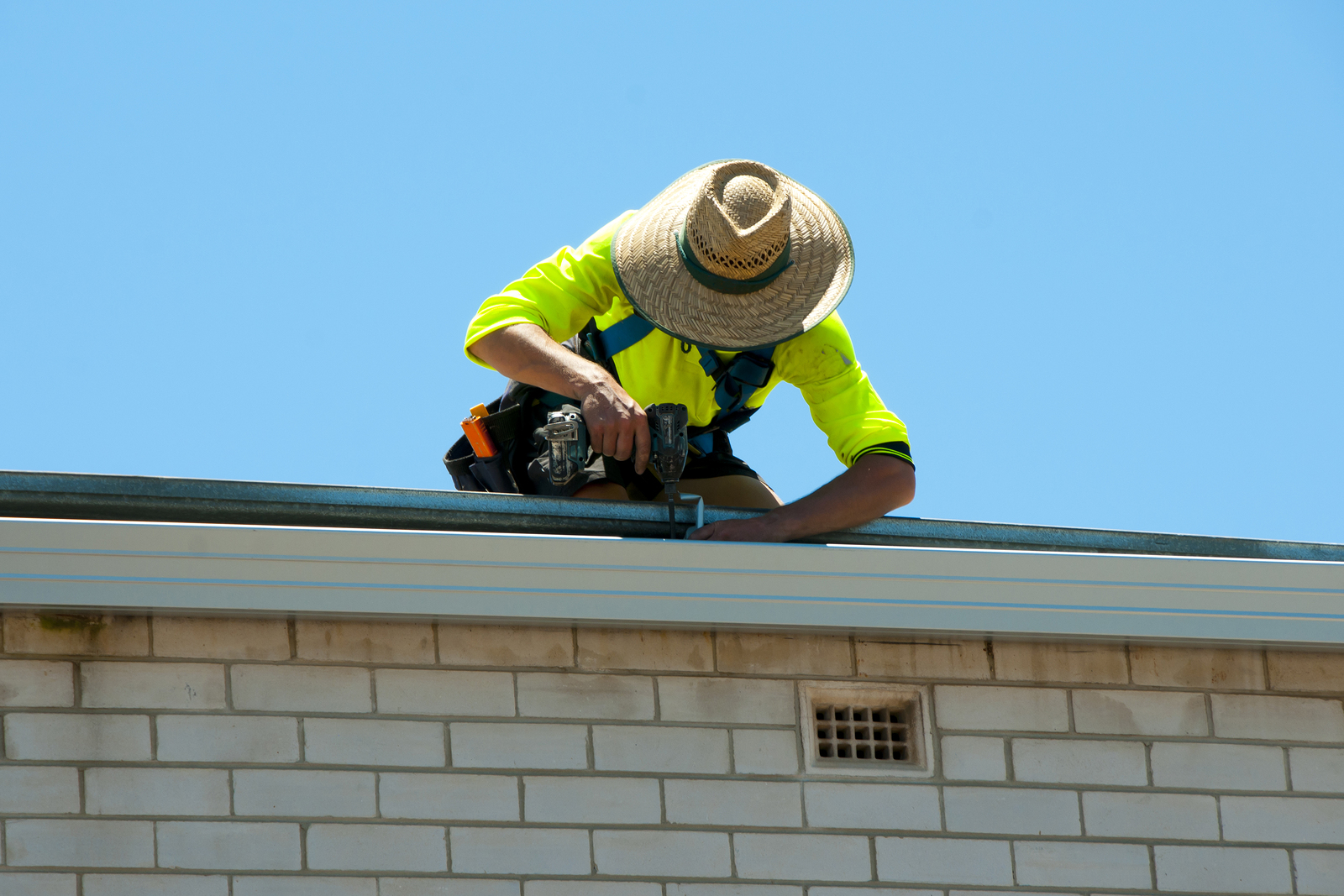 Roof expert repairing and maintaining commercial roof in perth