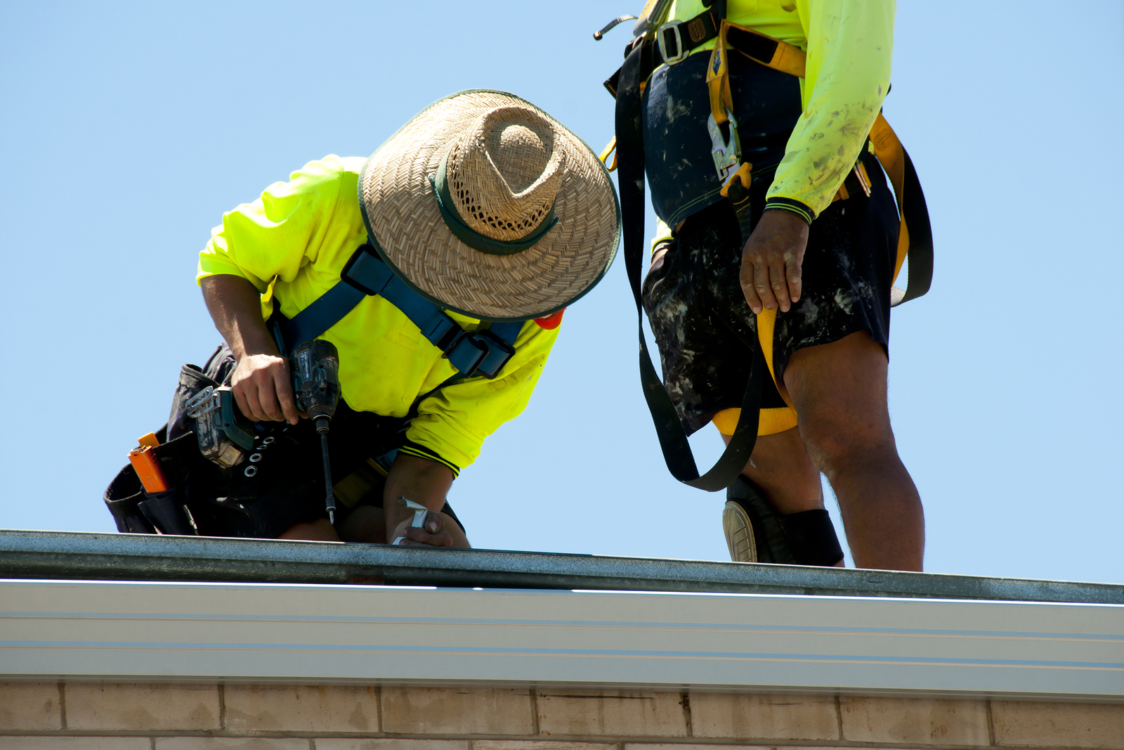 Professionals repairing and maintaining commercial roof in perth