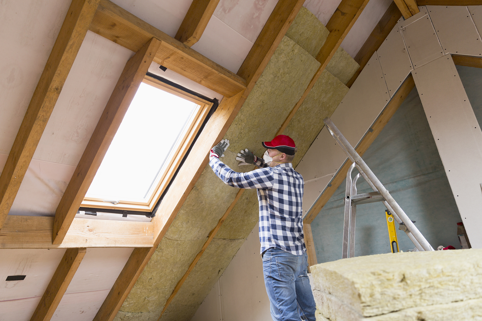 Professional installing roof insulation in perth home